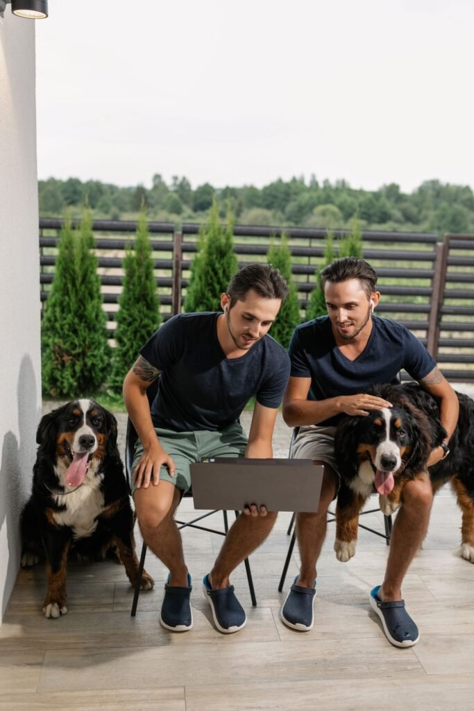 Family with dog laptop, related to how to compare pet insurance plans